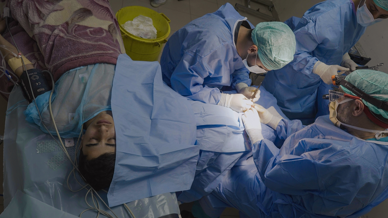 Doctor operating in a theatre