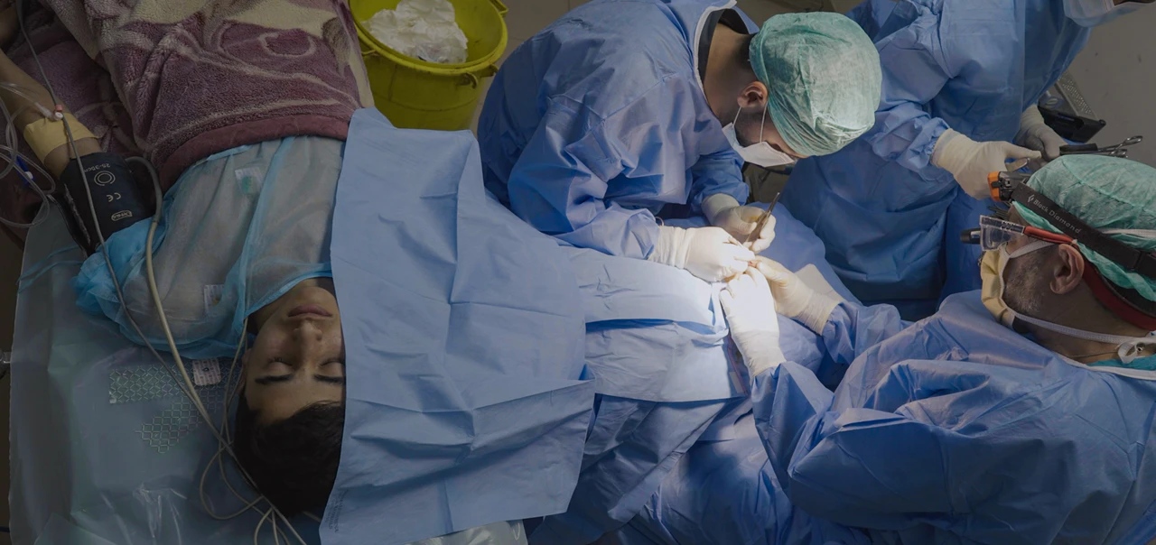 Doctor operating in a theatre