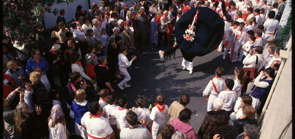 a folk procession with morris dancers and fantastical costume