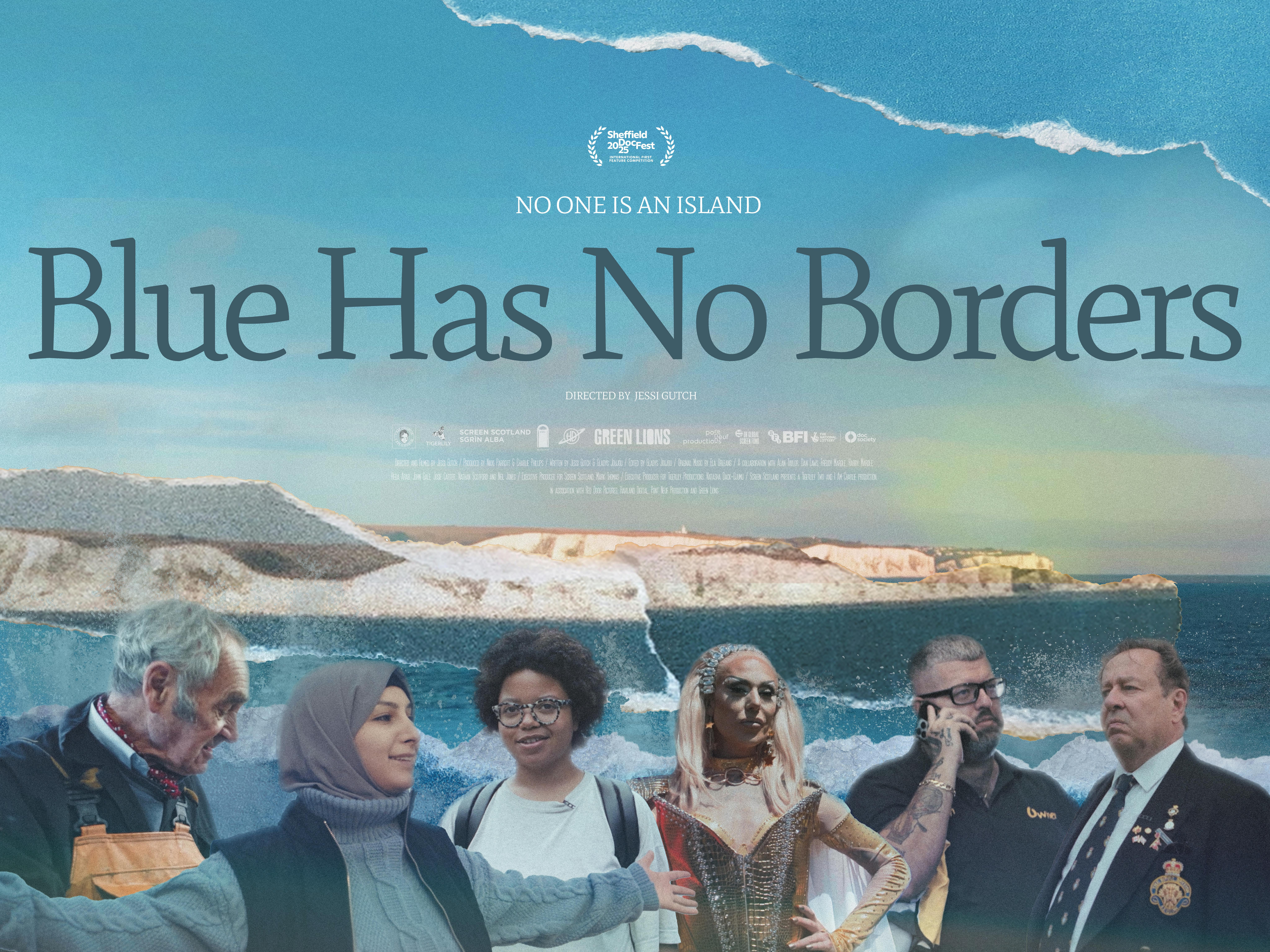 a group of people sit in a stone circle on the beach under a pink sunset