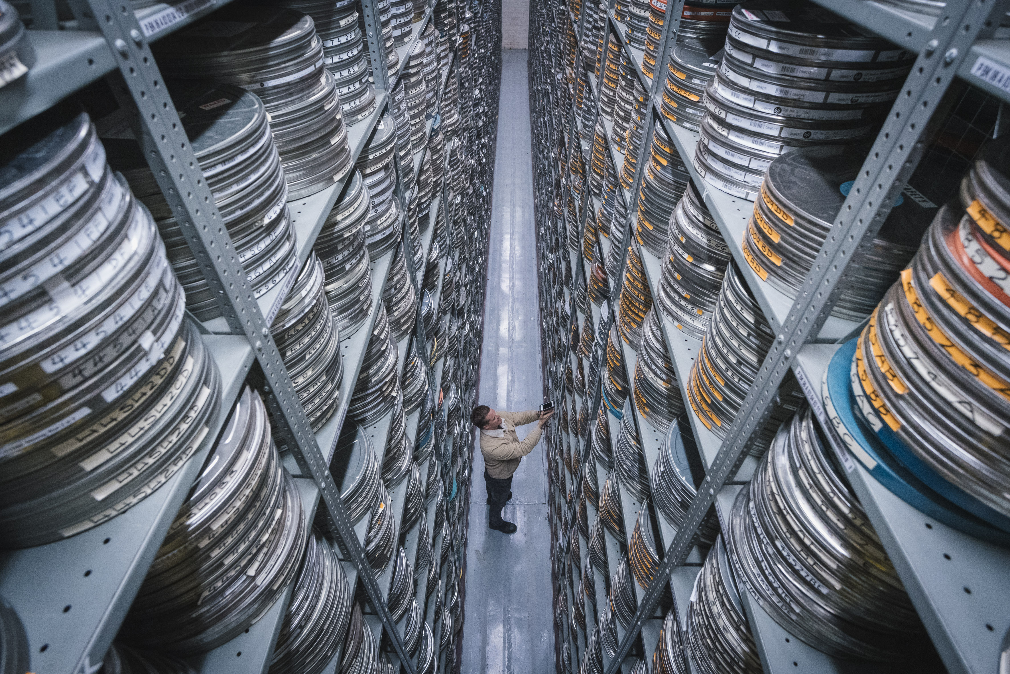 stacks of film reels on shelves