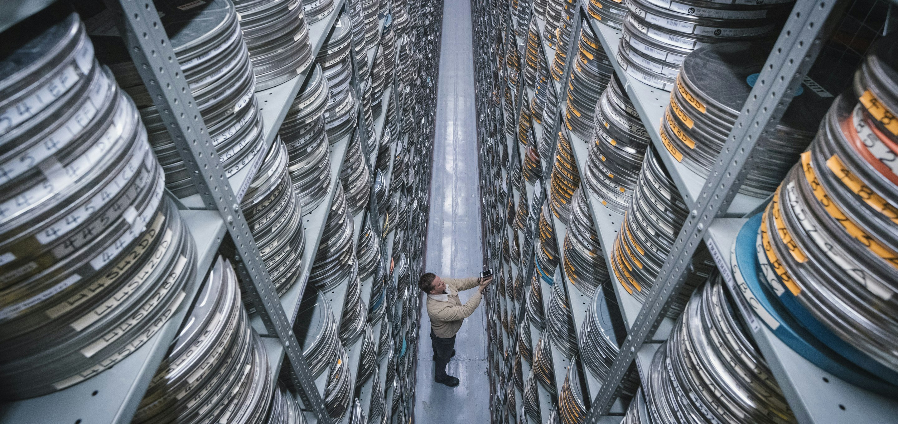 stacks of film reels on shelves
