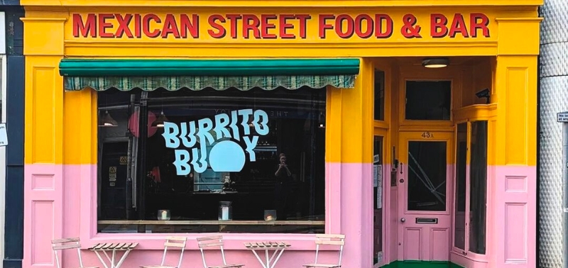 a brightly coloured shop front with a sign saying Mexican Street Food & Bar