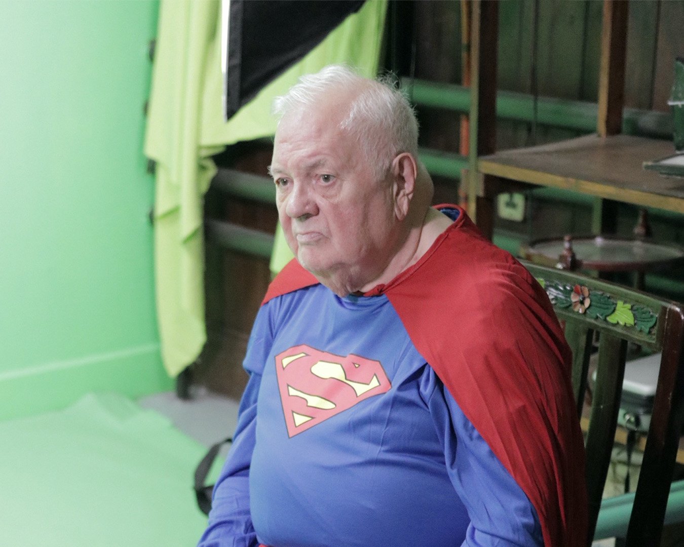elderly man in superhero costum