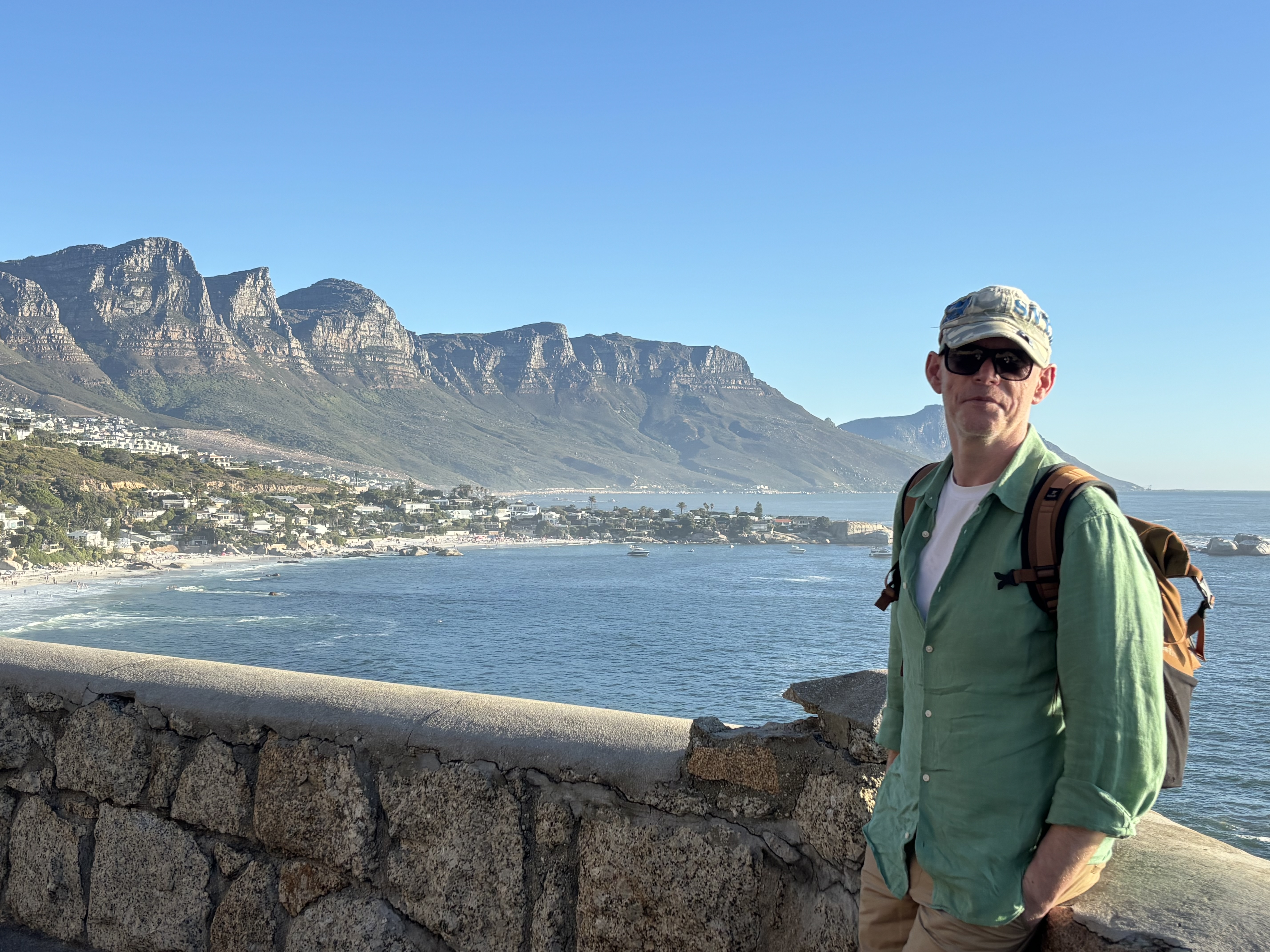 Declan standing in front of a mountain scene