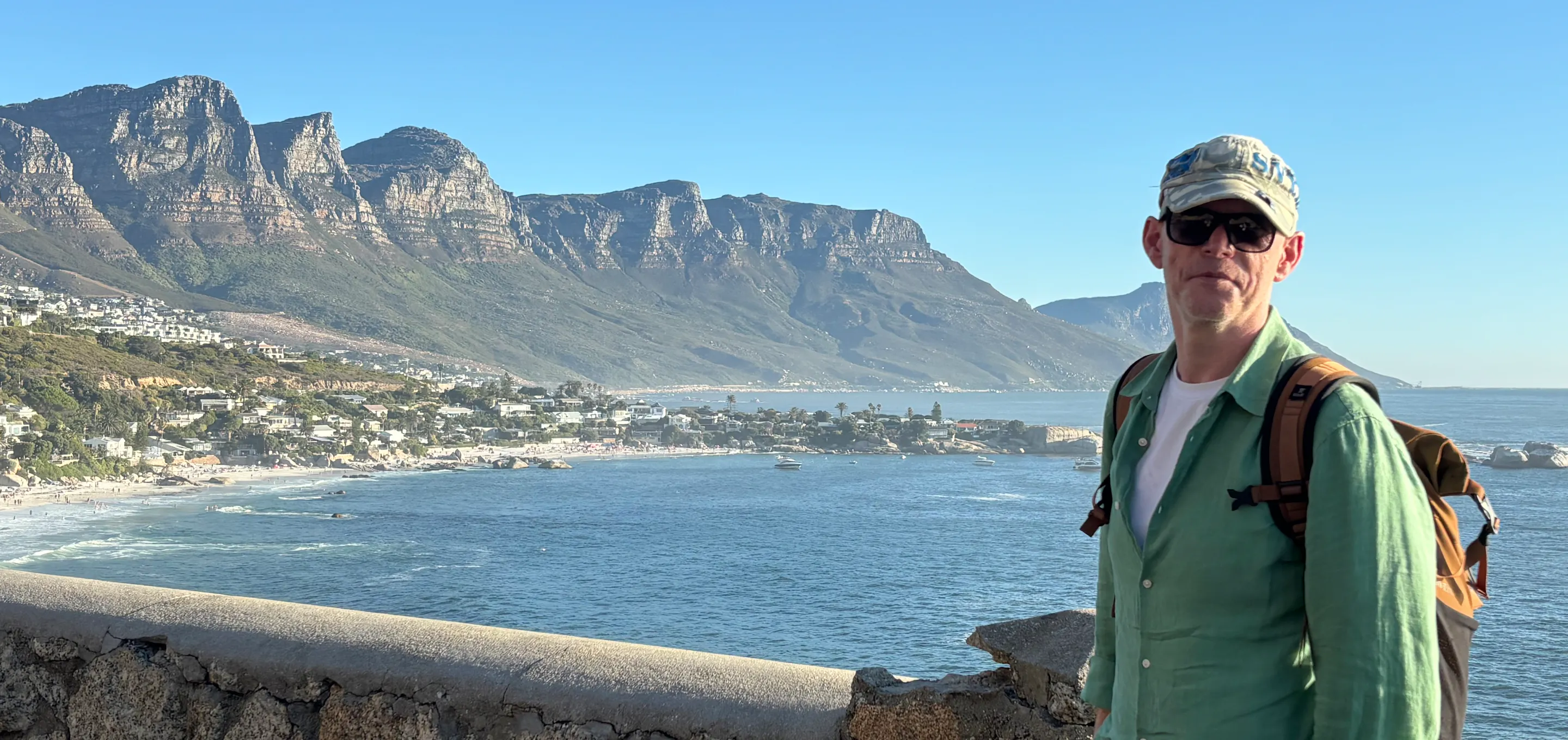 Declan standing in front of a mountain scene