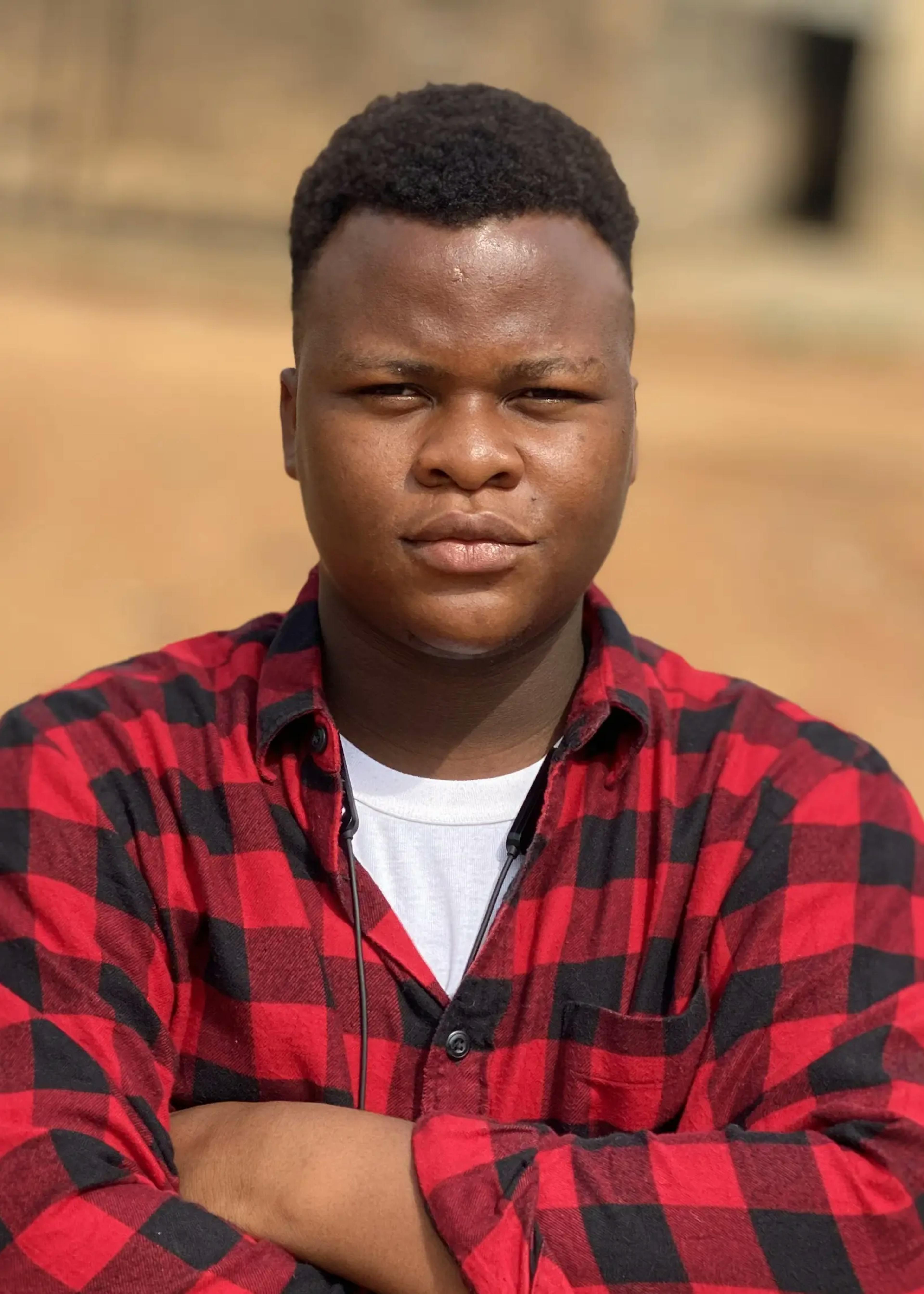 boy wearing red and black check shirt