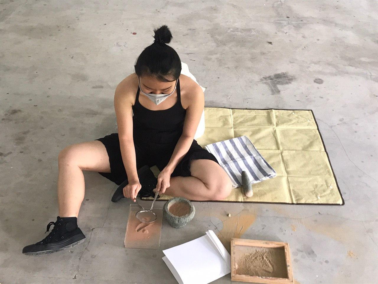 Sieving dried and grounded soil