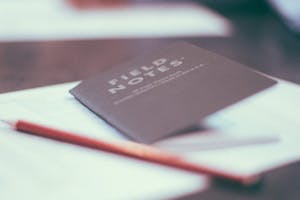 Field note notebook and pencil