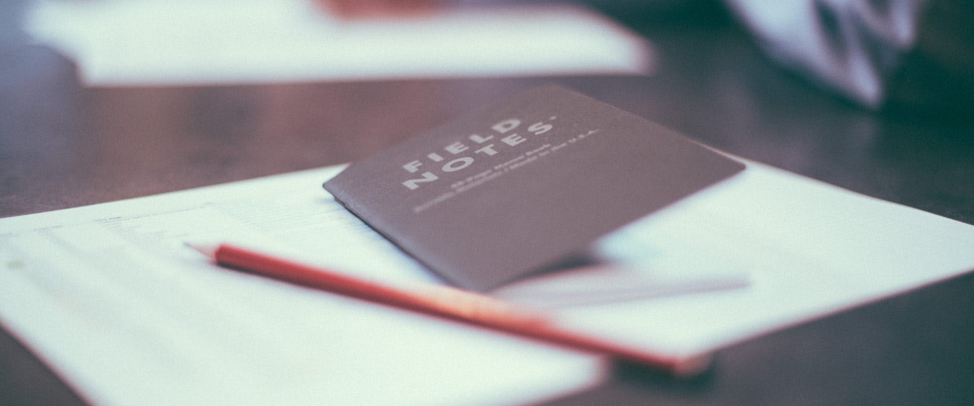 Field note notebook and pencil