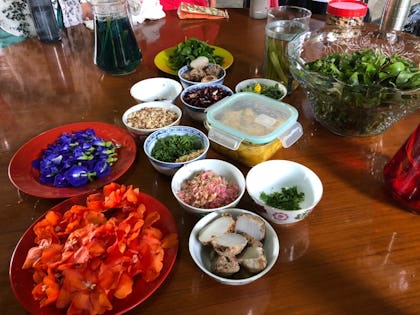 plates and bowls of a colourful array of garden produce on a table