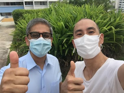 Chris and MP Leon both with thumbs up and mask on posing for the photo