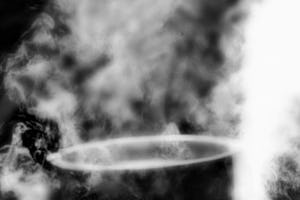 Black and white photo of a pot shrouded in smoke