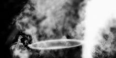 Black and white photo of a pot shrouded in smoke