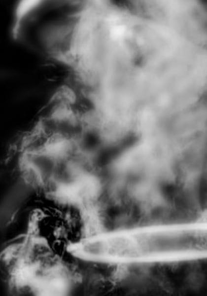 Black and white photo of a pot shrouded in smoke