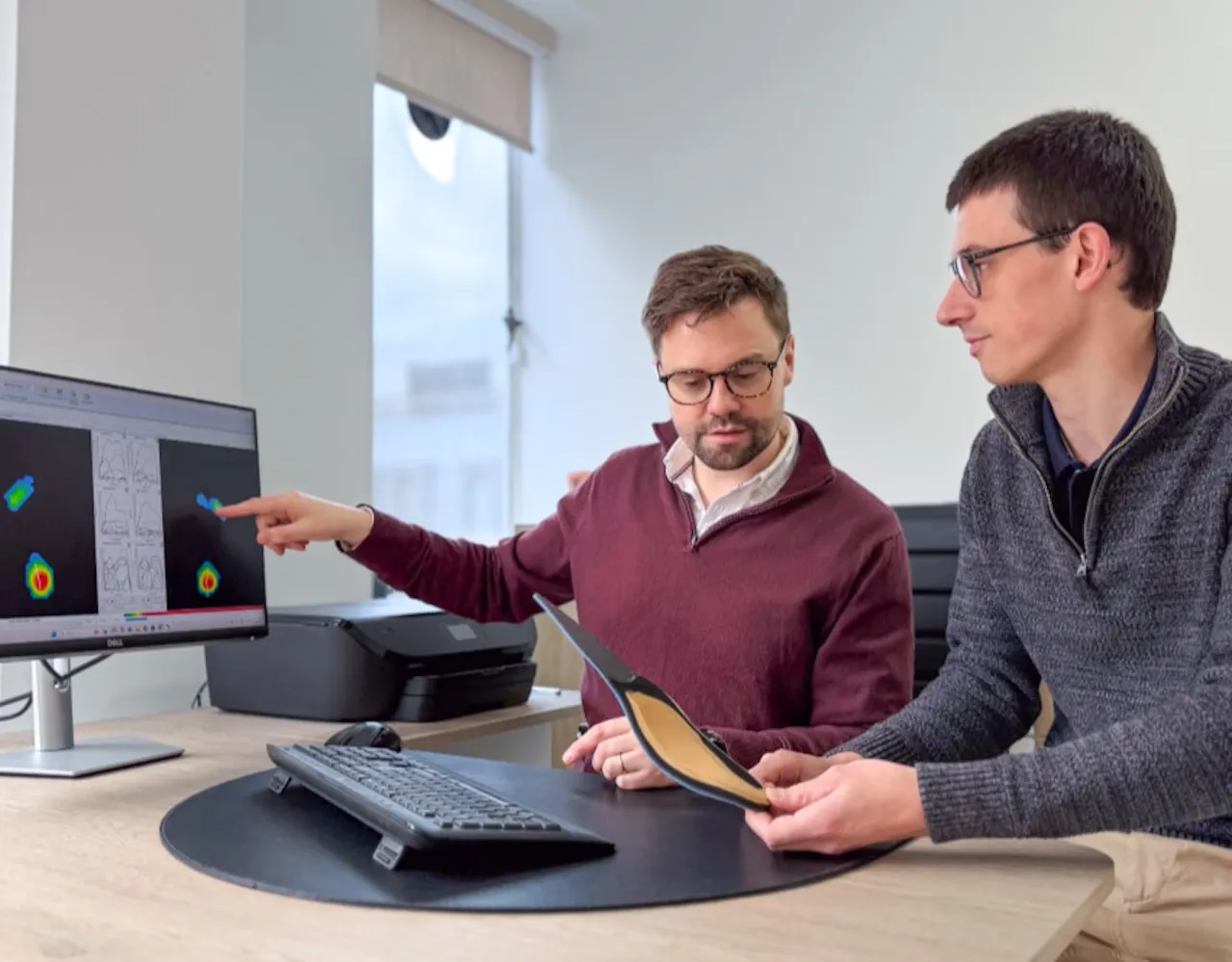 Podiatrists discussing orthotic treatment plan 