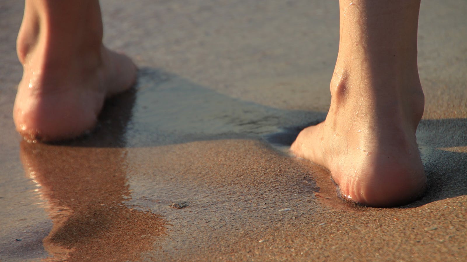 Bearfoot in the sand