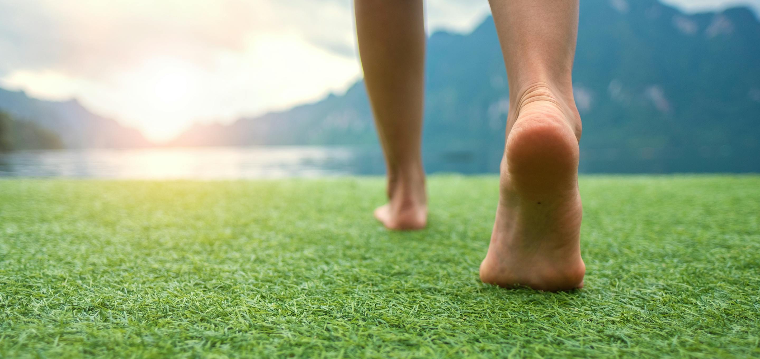 feet walking on grass