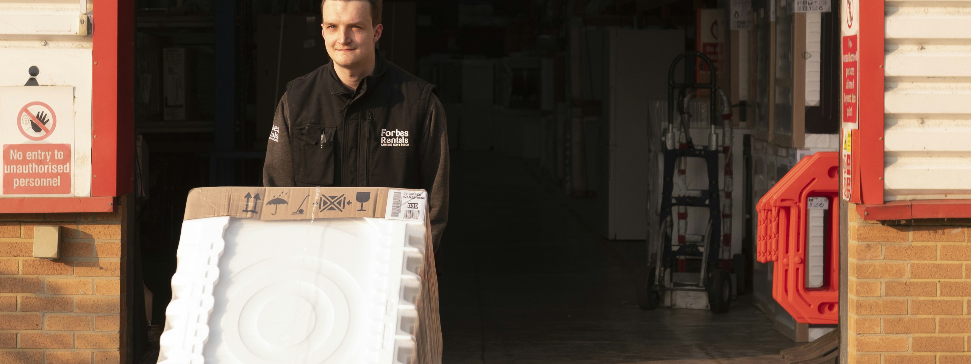 Forbes Professional Warehouse Employee Pushing Washing Machine