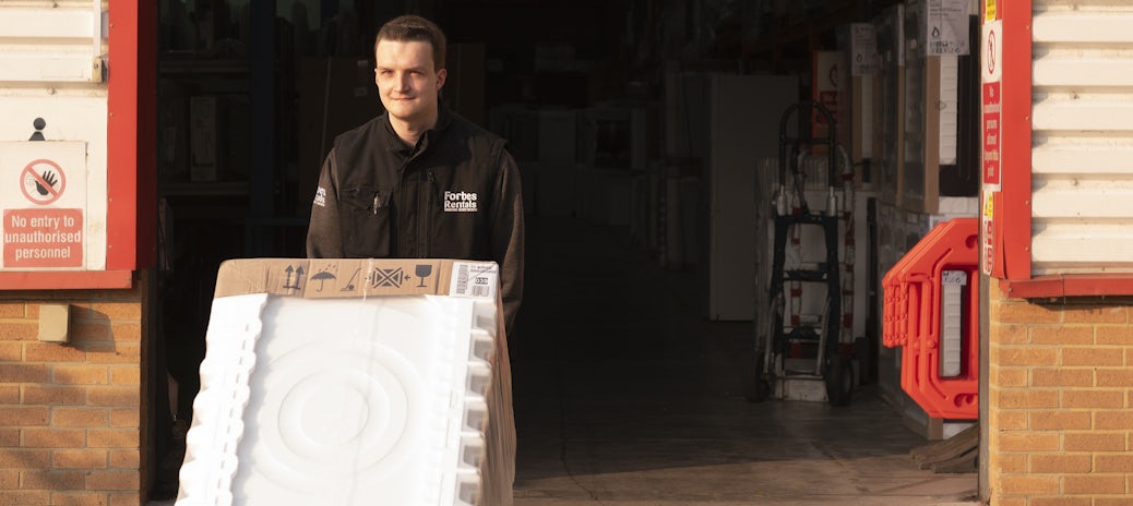 Forbes Professional Warehouse Employee Pushing Washing Machine