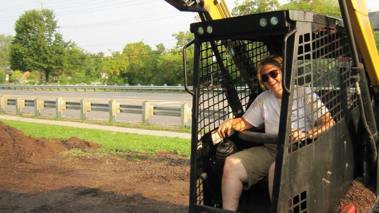 Woman operating heavy machinery