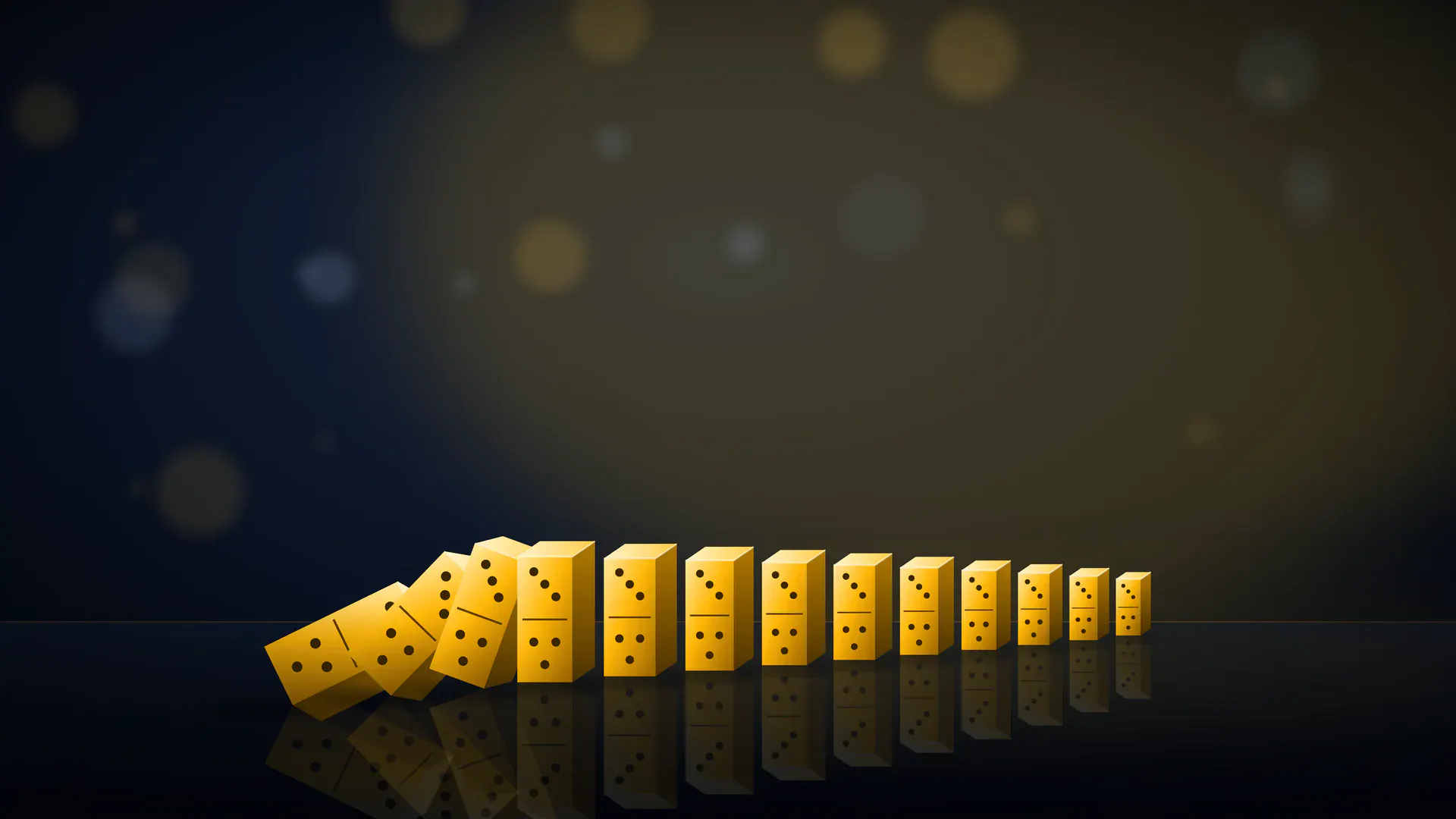 A row of gold dominoes on a dark reflective floor, with the first three falling into the rest.