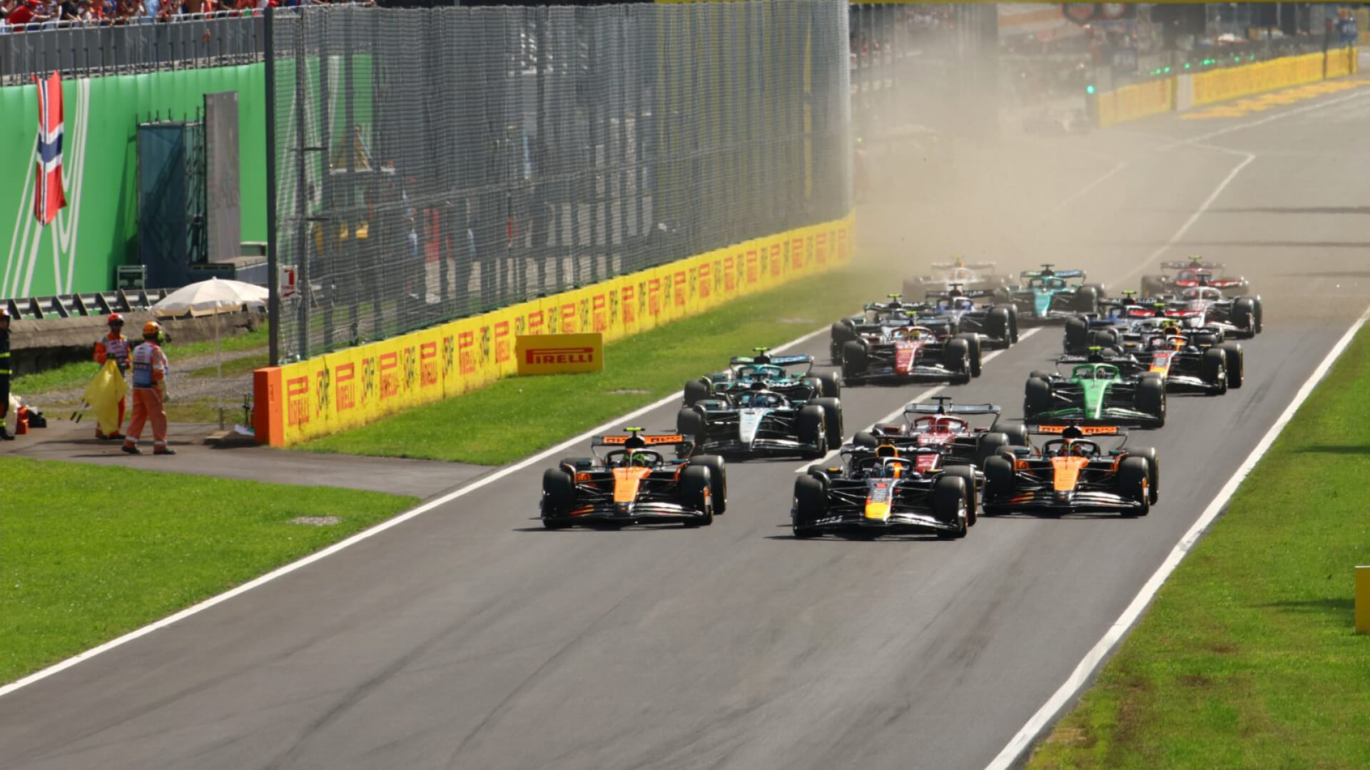 Formula 1 cars accelerate down the Monza straight during the Italian Grand Prix.