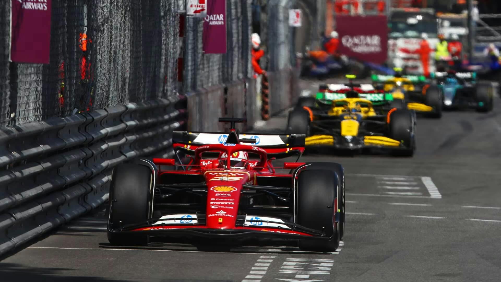 F1 cars between the guard rails in the streets of Monaco.