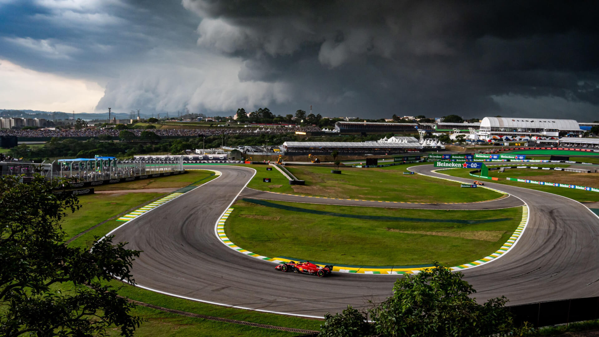 A Ferrari in the Bico de Pato corner with dark sky in the background