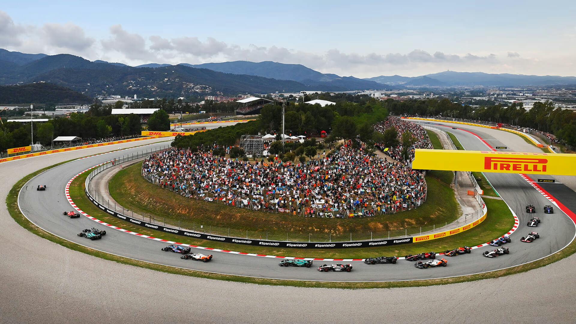 F1 cars in famous Renault curve at Circuit de Barcelona-Catalunya