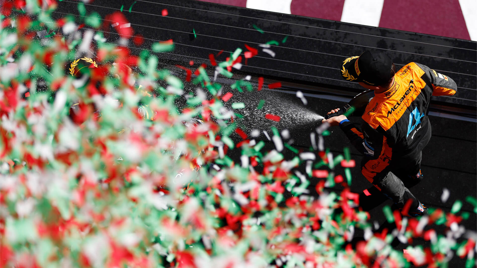 Piastri celebrates on the podium after winning his first F1 race at the 2024 Hungarian GP.