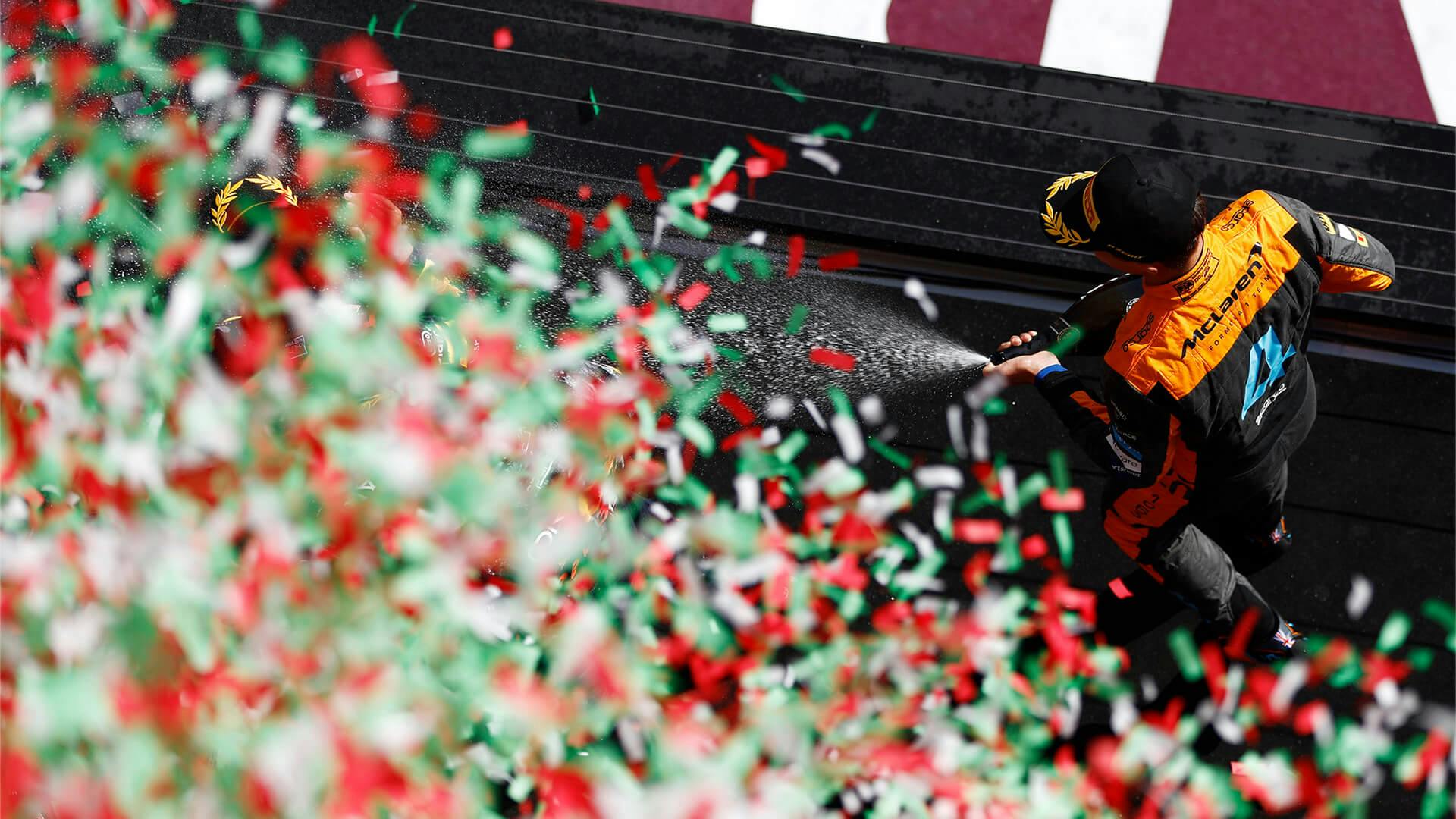 Piastri celebrates on the podium after winning his first F1 race at the 2024 Hungarian GP.