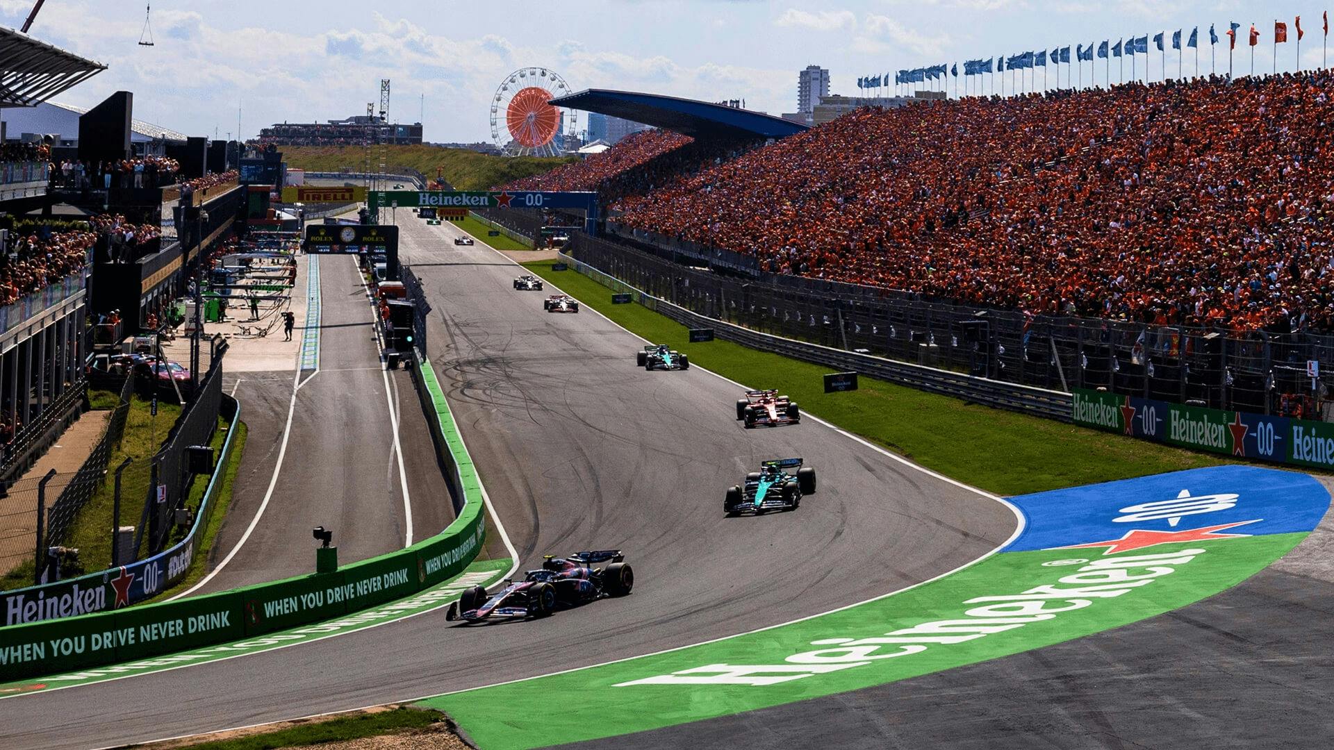F1 cars in the first corner of 2024 Dutch Grand Prix.