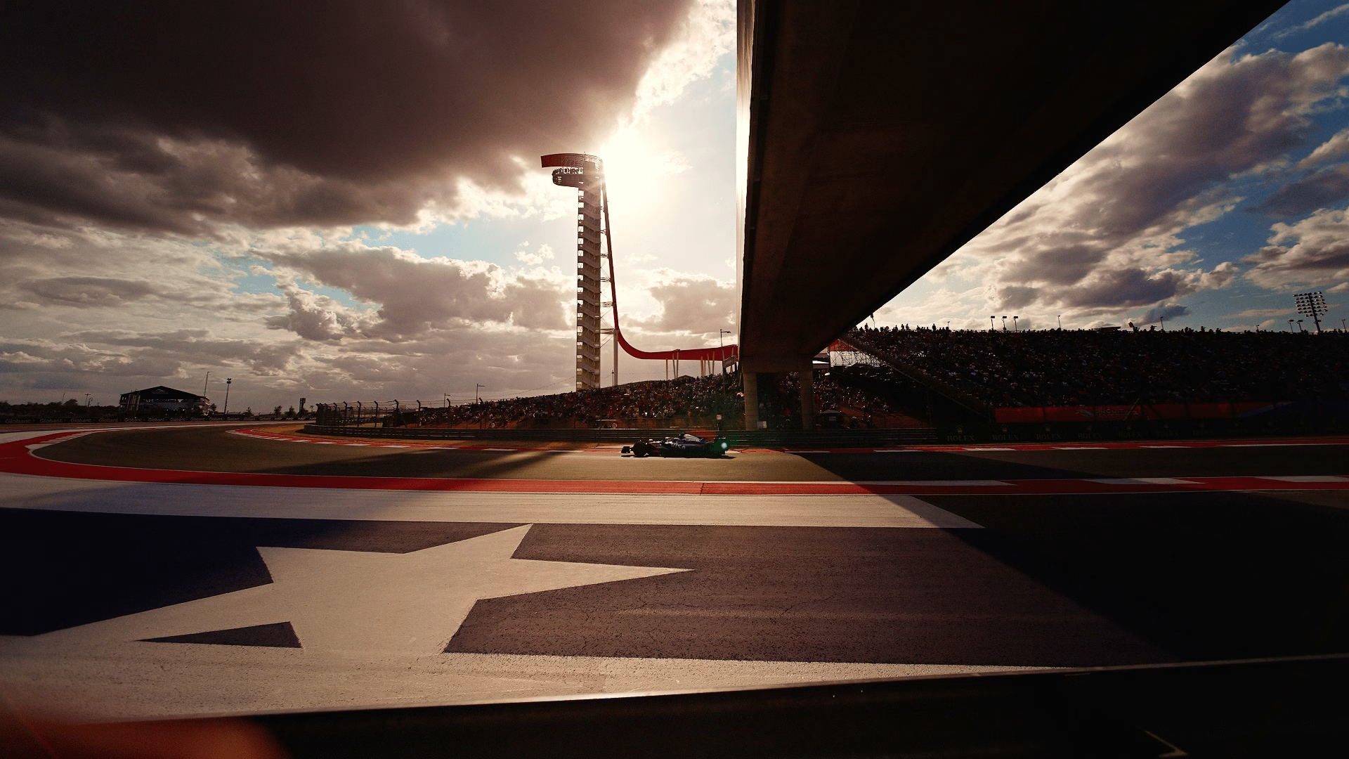 United States Grand Prix, Round 19, featuring the COTA track outline and a car on the circuit with the observation tower under a dramatic sky.