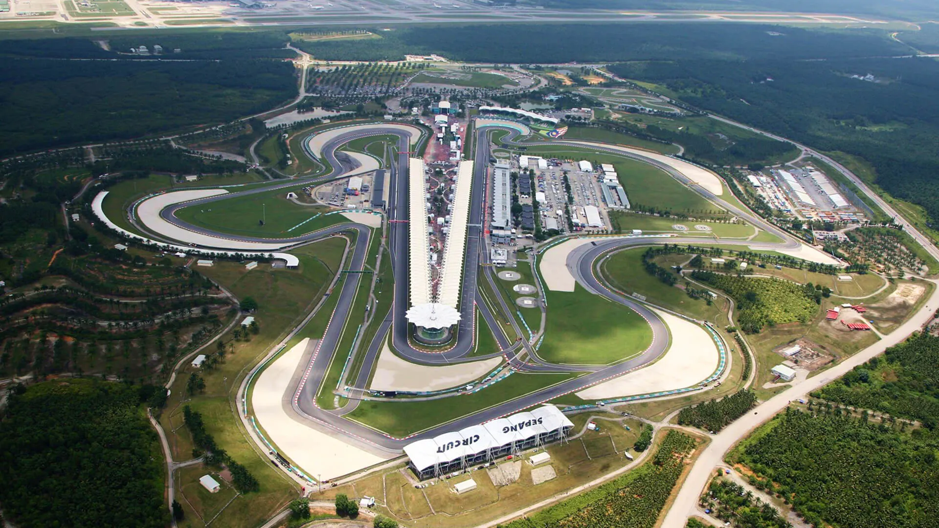 Aerial view of Sepang International Circuit in Malaysia, showing its twin straights, grandstands and sweeping corners.
