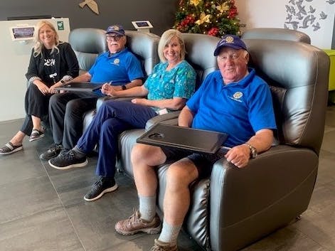 An image of representatives from Forté Hospital and Belfast Kaiapoi Rotary with the five day-stay chairs being donated to hospitals in Samoa.