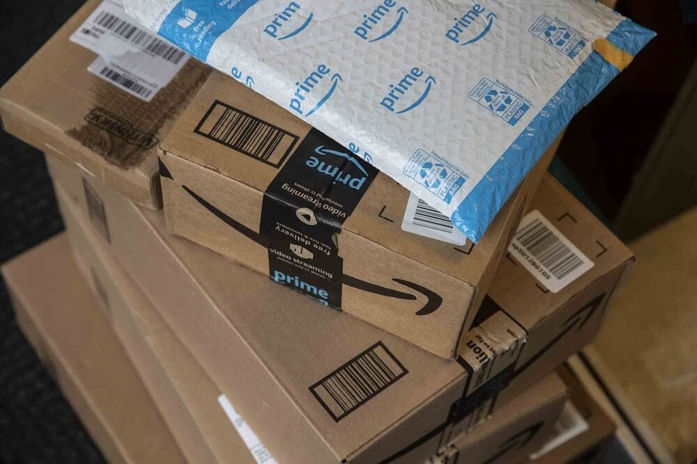 the packaging lays on top of several packages of amazon products