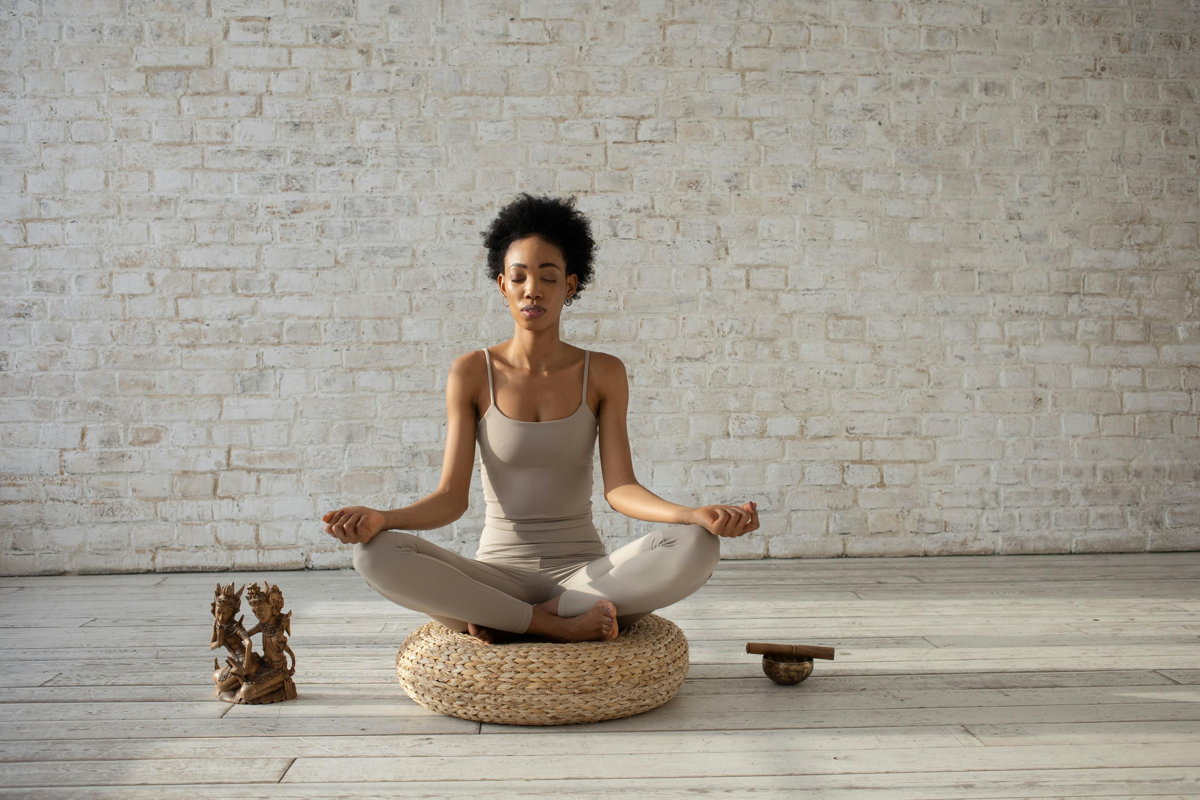 Women gracefully practice yoga in her yoga clothes