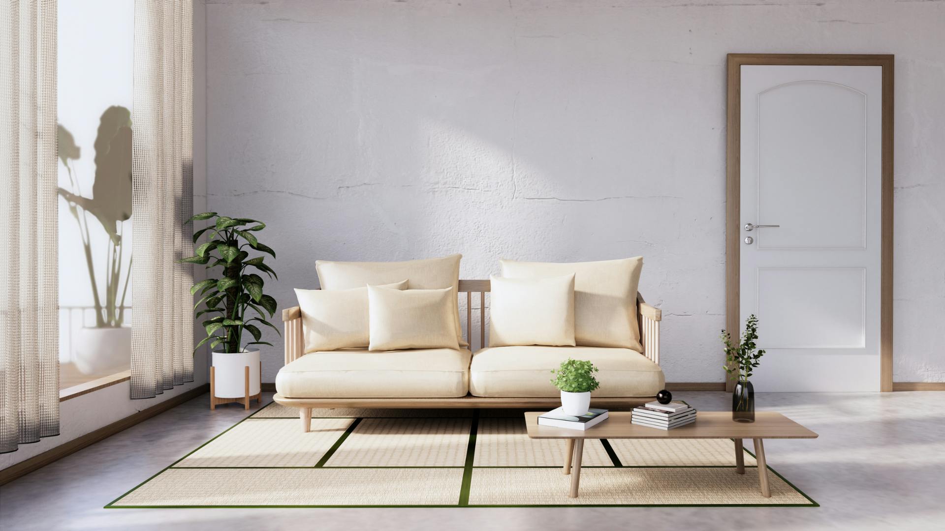 A couch, rug, and coffee table as furniture in a a big room