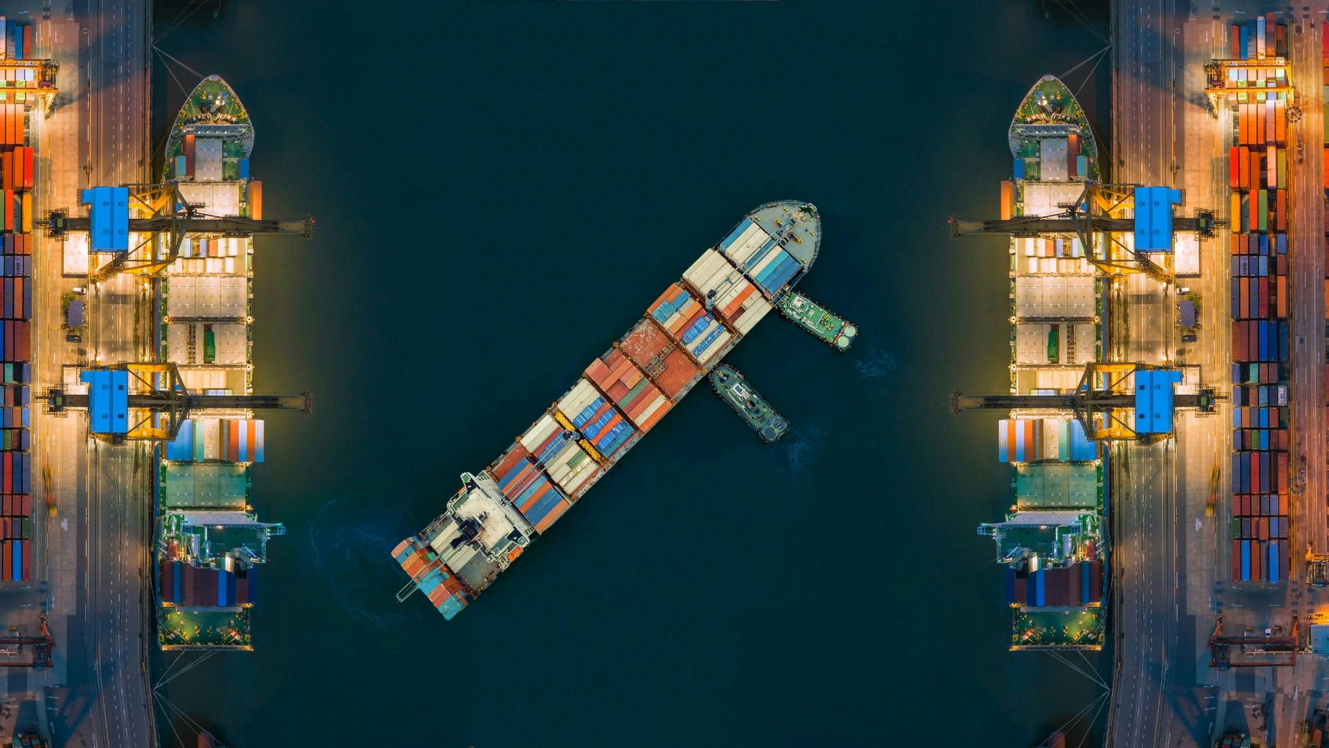 A ship leaving the dock to deliver the packages internationally. 