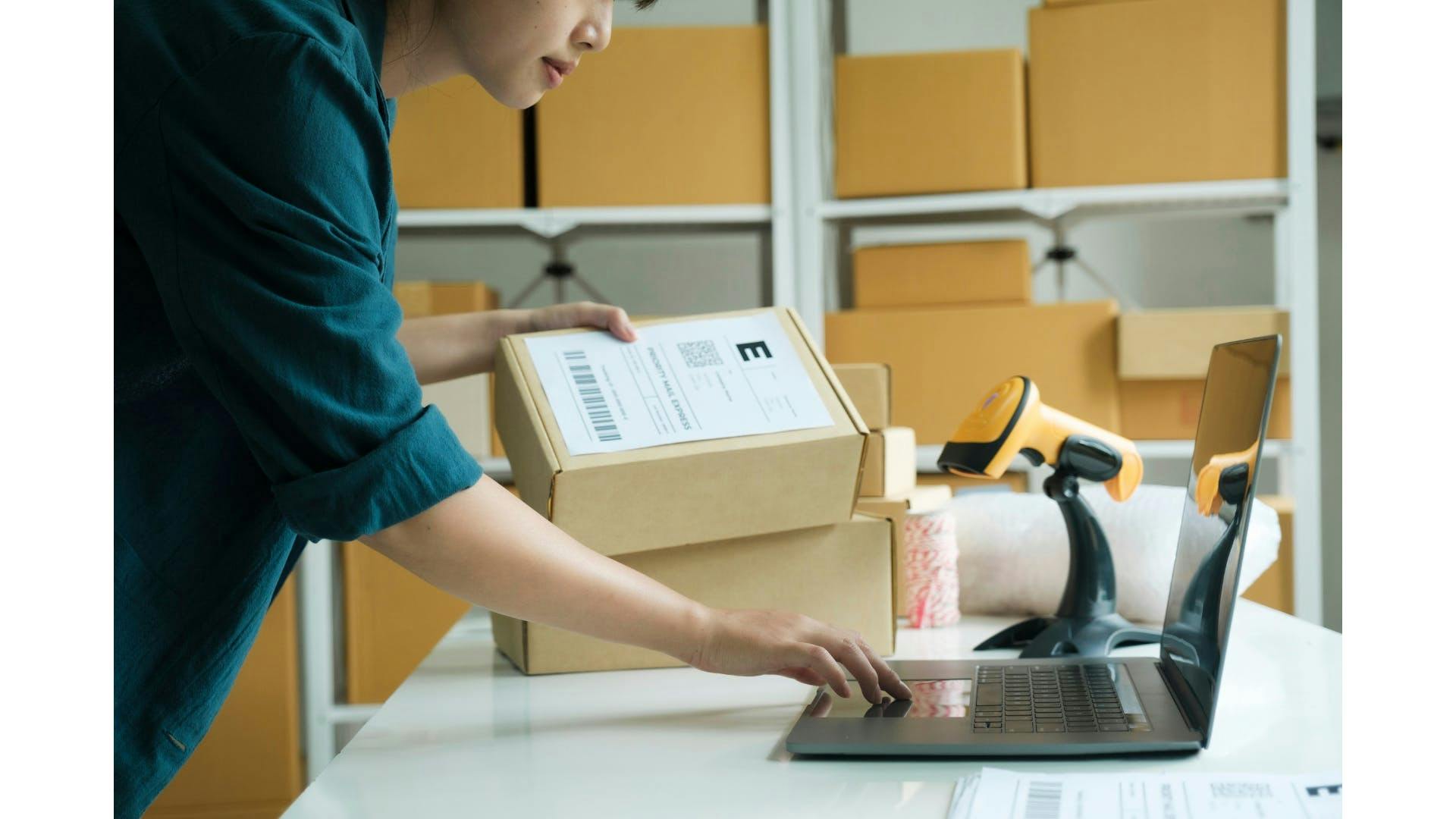 A person preparing an order that their customer placed online.