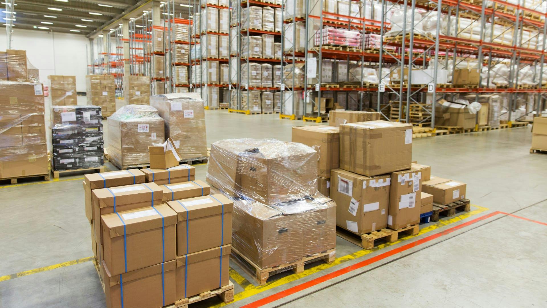 Shipping packages are on top of a crate ready to be shipped. Shipping packages are on top of a crate ready to be shipped.