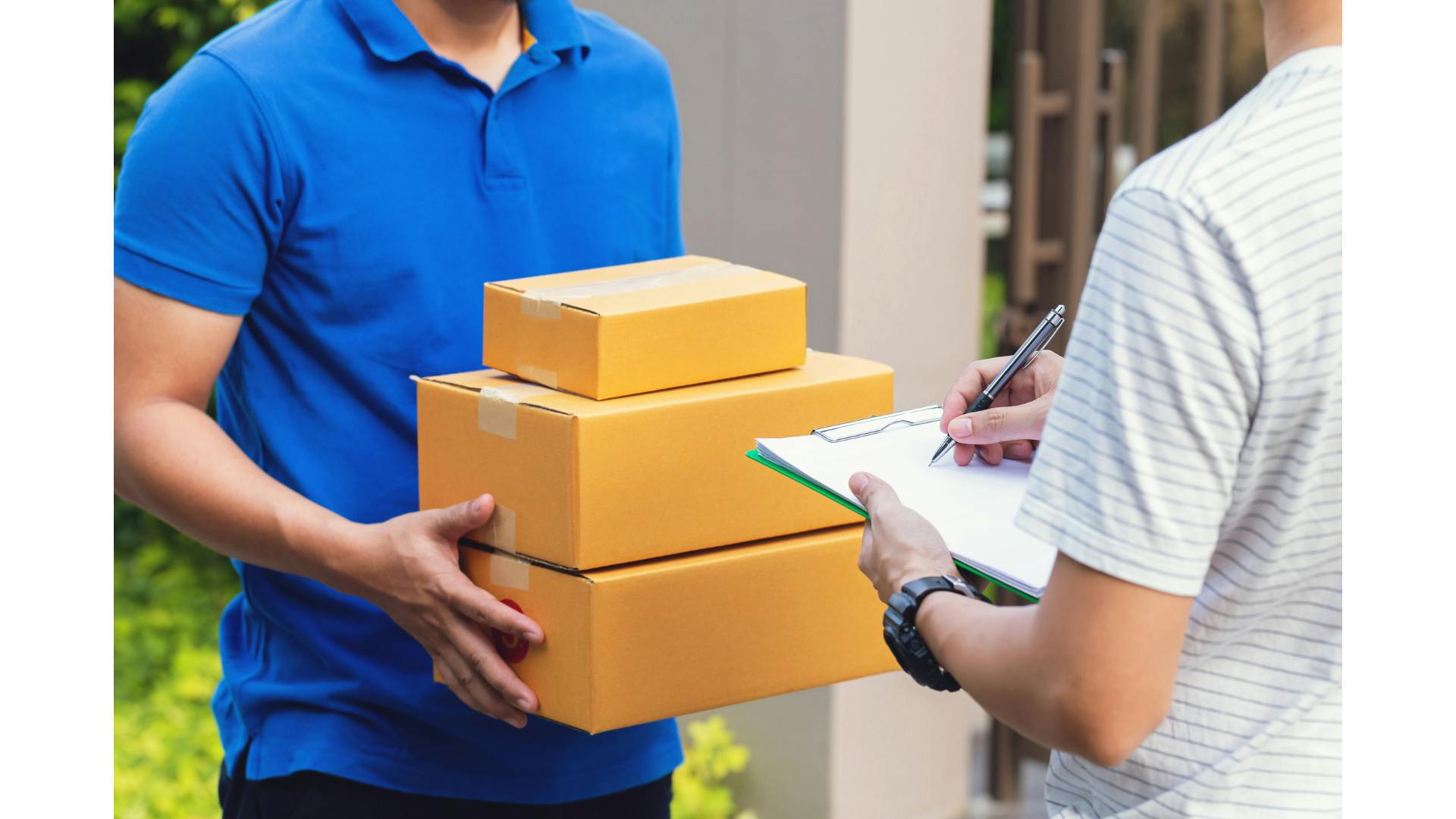 A man delivering 3 packages stacked. 