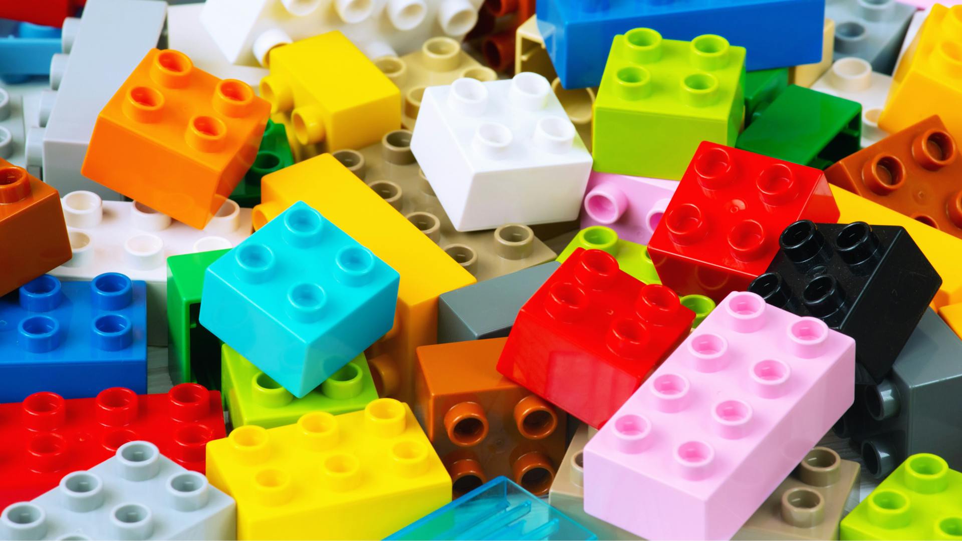 Bricks of Lego spread around. Bricks of Lego spread around.