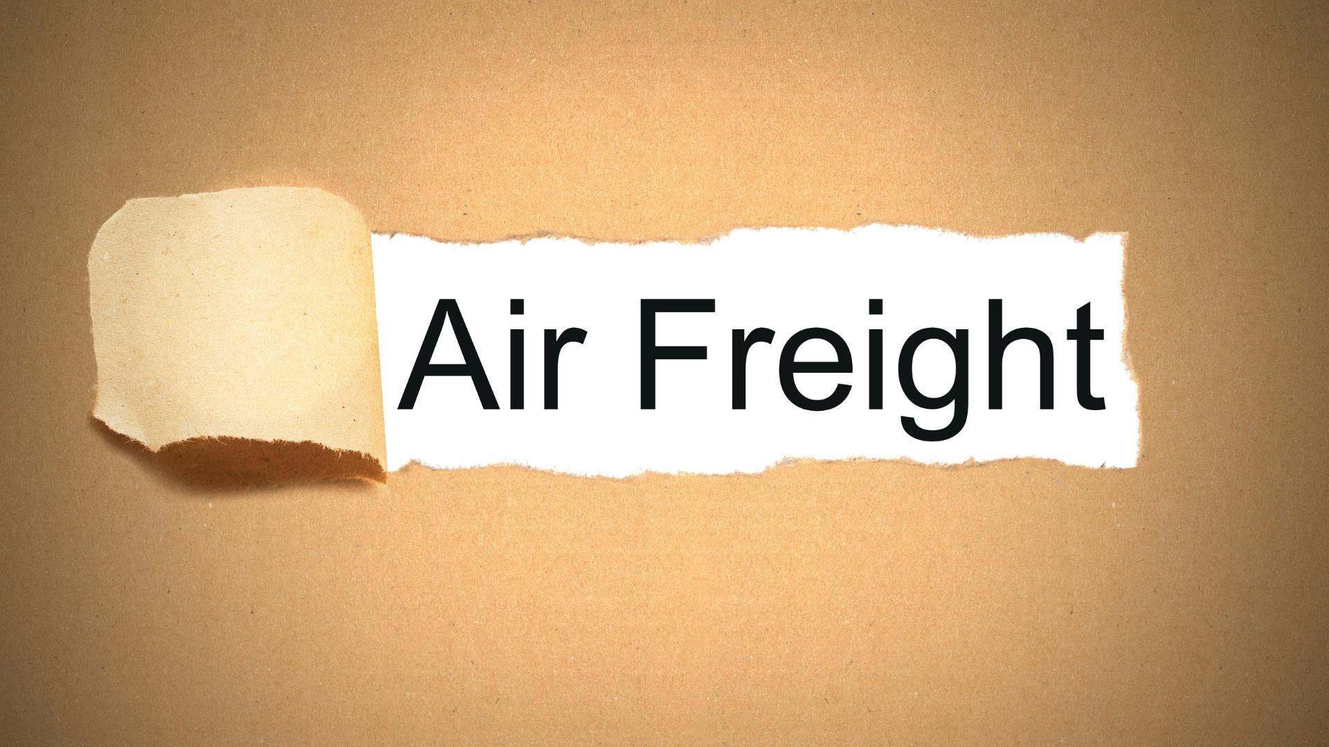 A brown backgroun ripped apart like paper, written 'Air Freight' on white background. 