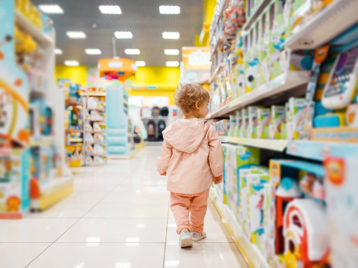 A child walks on toys aisle. 