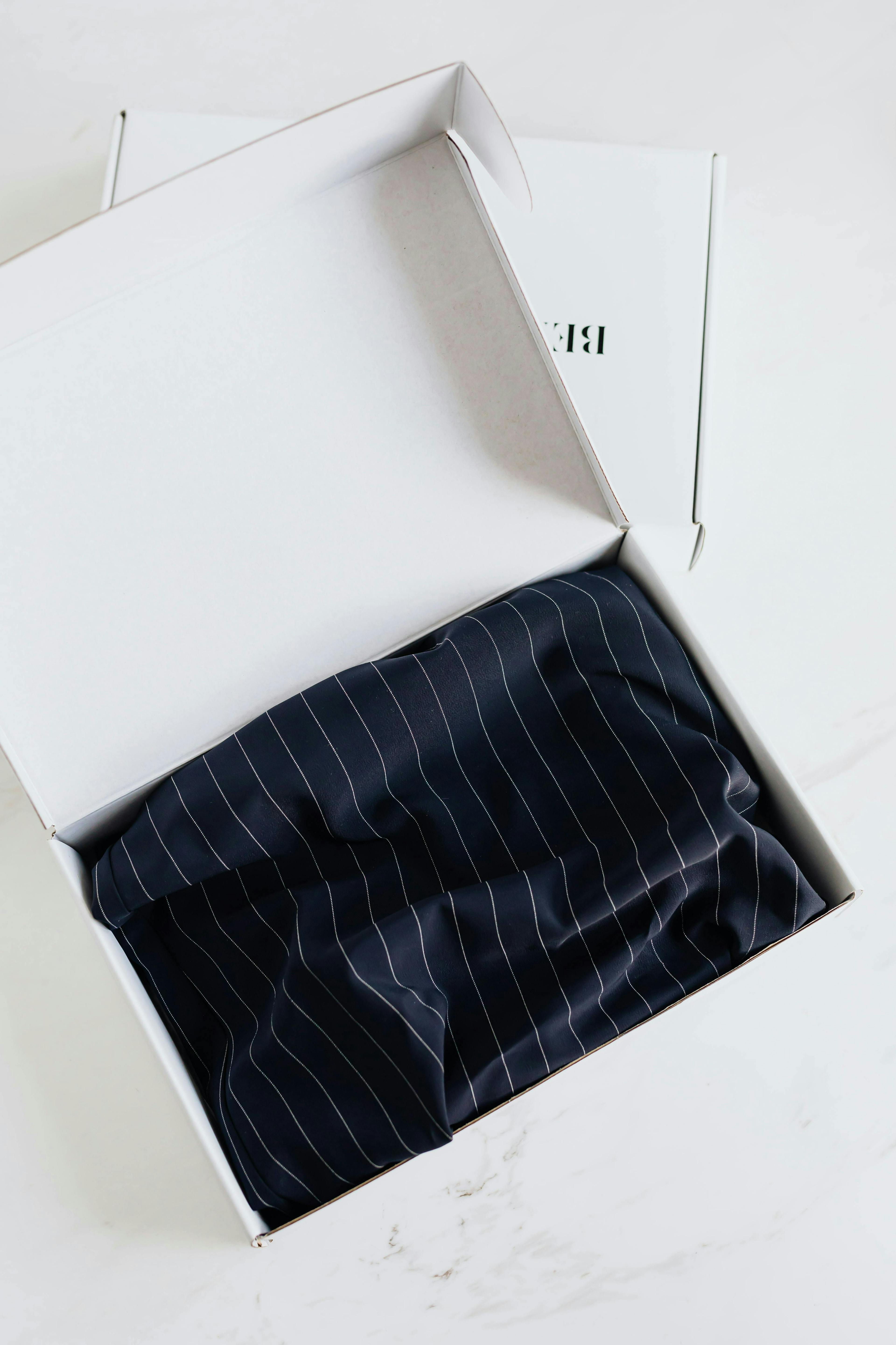 Ralph Lauren item in a white shipping package representing high-end packing. 