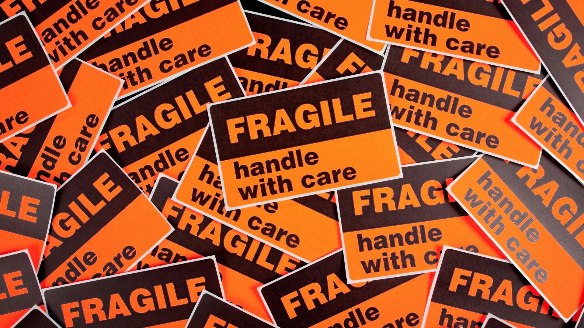 Stickers "Fragile- handle with care" written on them. 