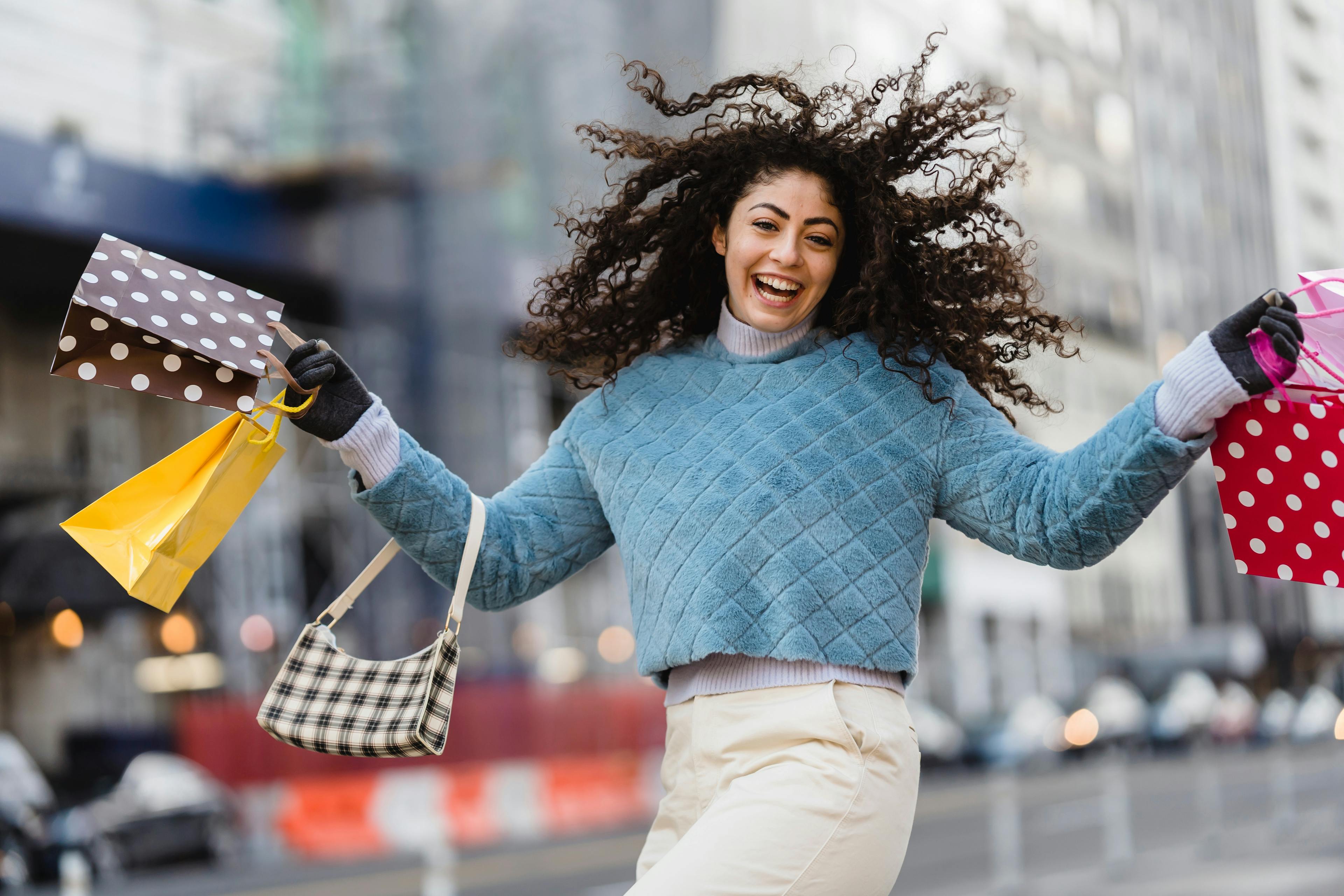 a happy woman with shopping packages. 