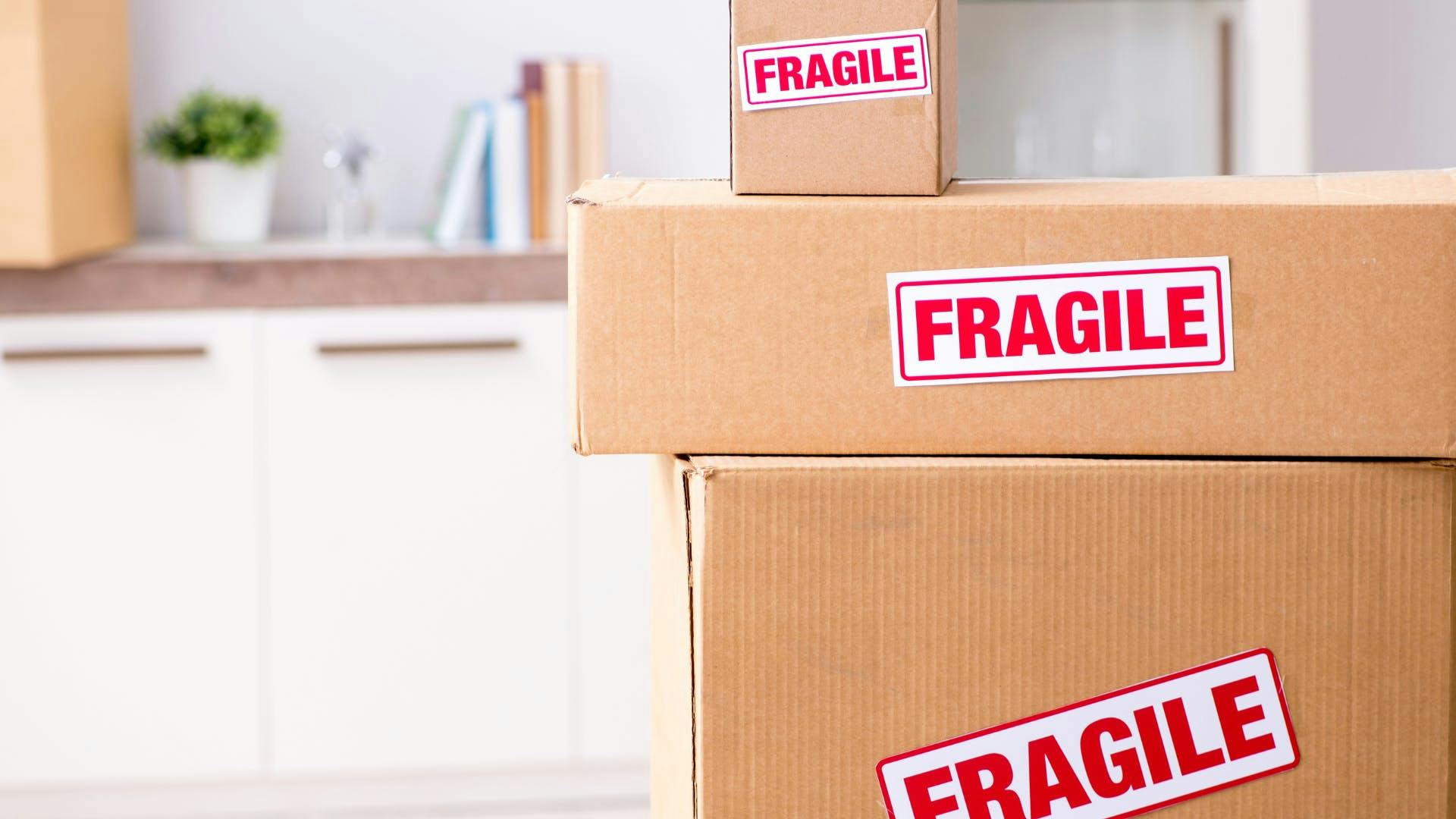 3 packages stacked on top of each other with fragile label.